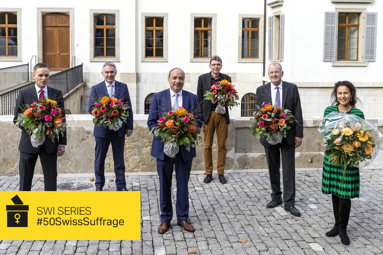 5 men and 1 woman, all holding flowers