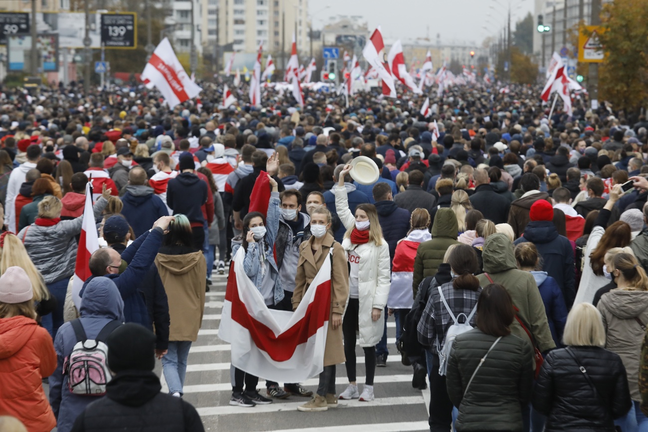 Demonstrators with Belarus flag in street