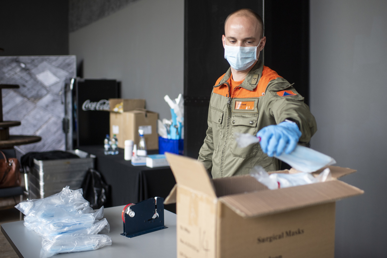 Army staff unpacking protective face masks