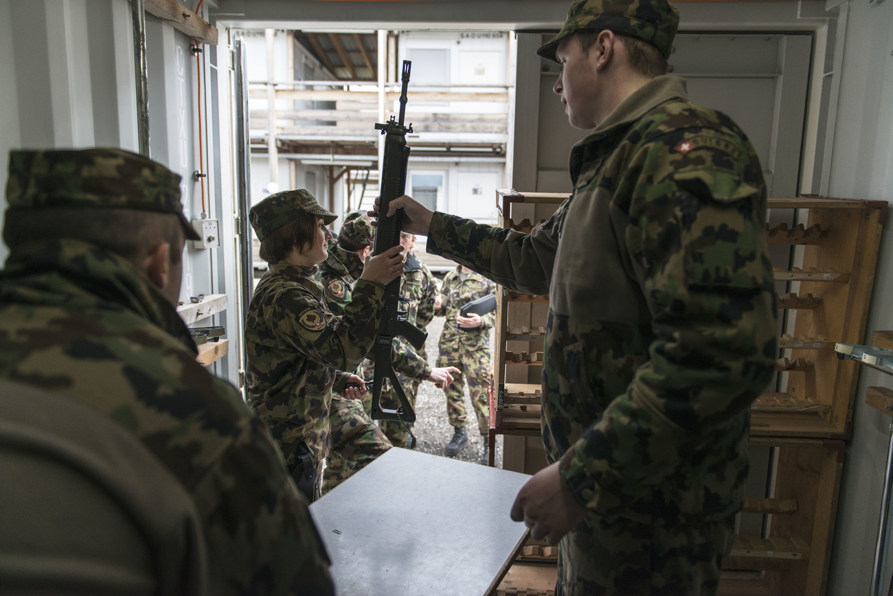 Soldier handing over a gun