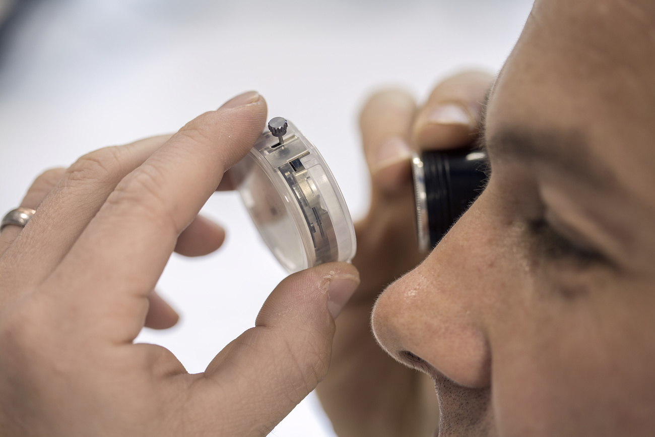 Man inspects timepiece