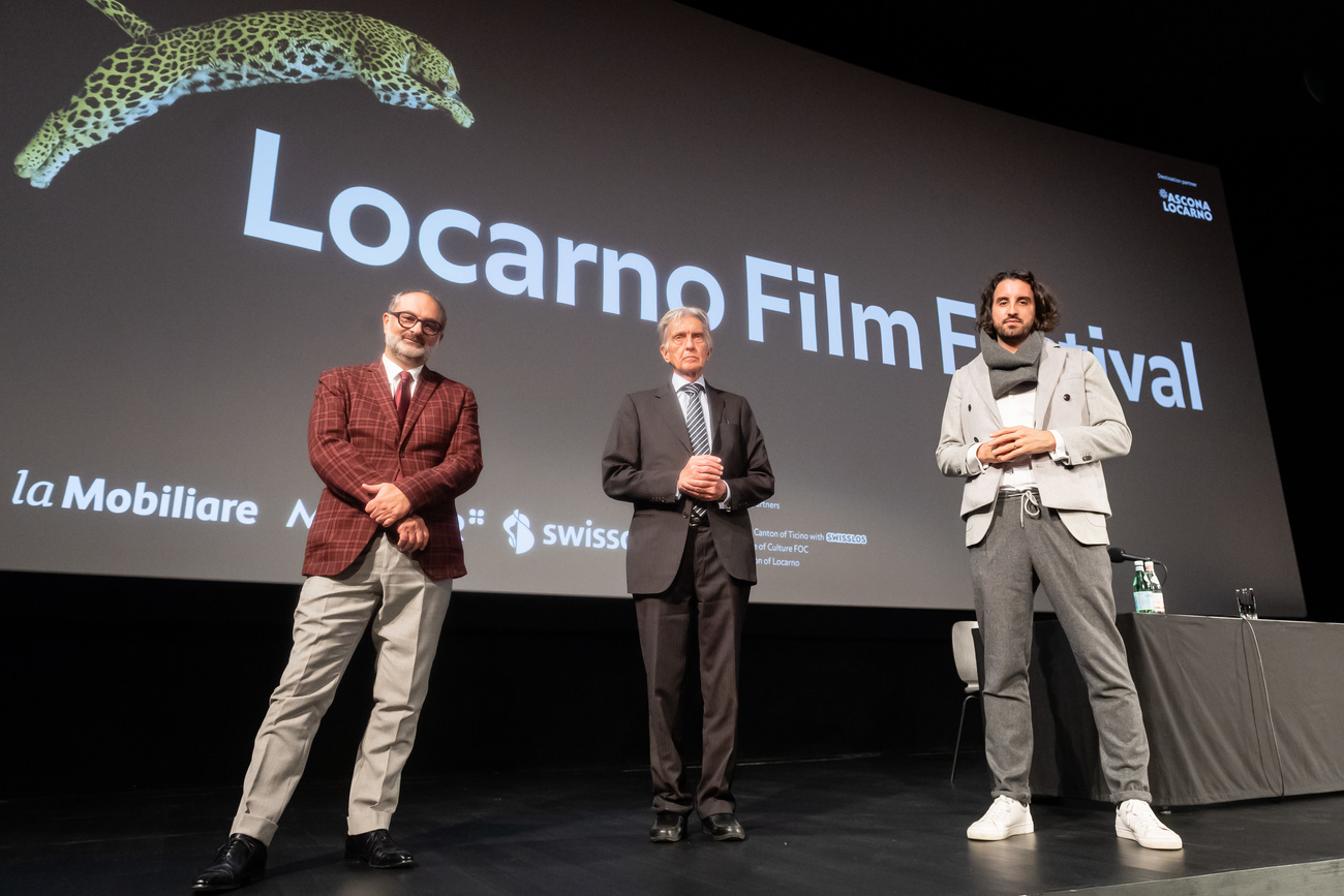 tre persone sul palco del festival di locanro