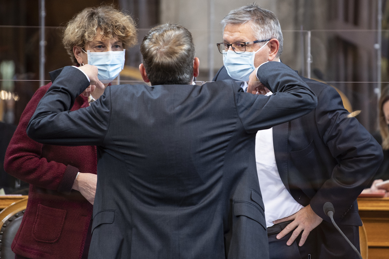 Three Senators in discussion