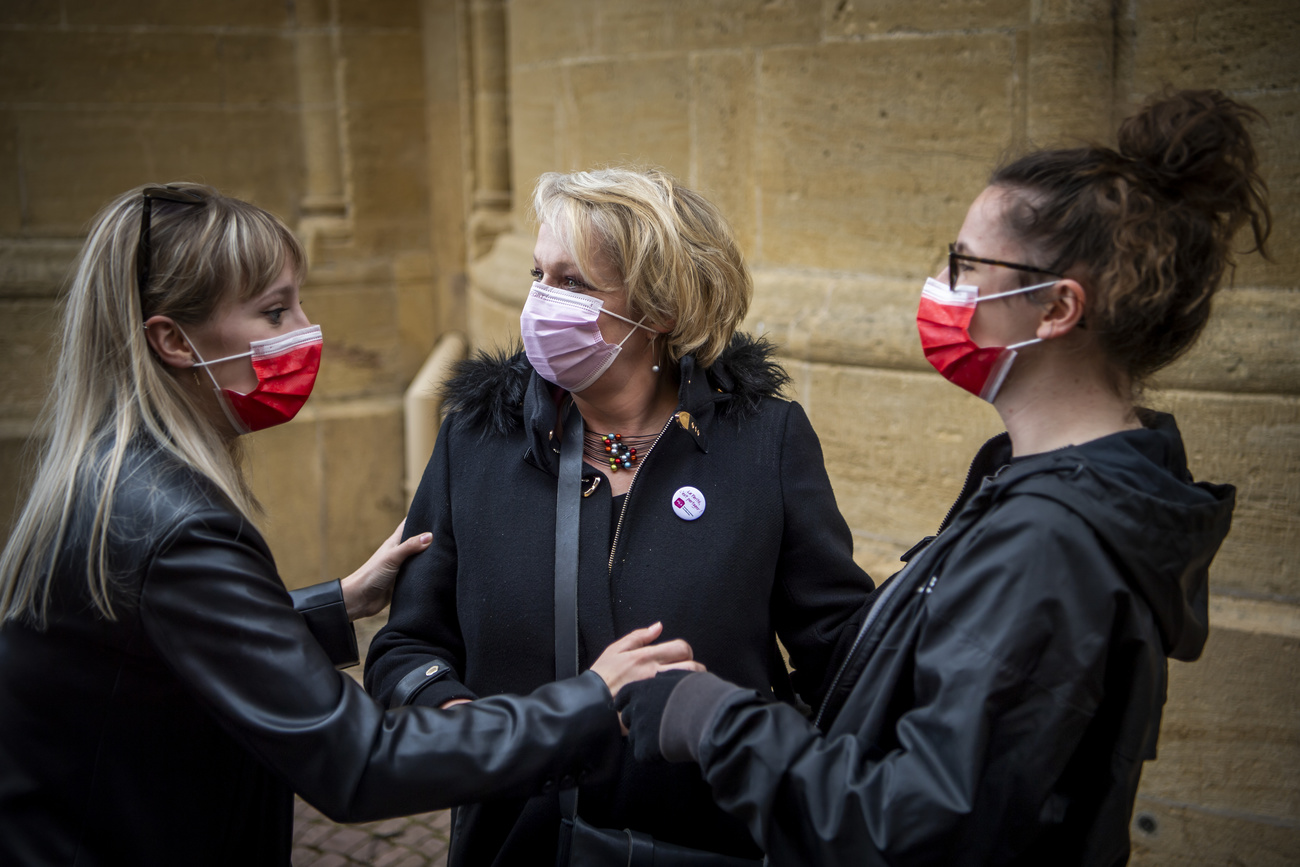 Parliamentary candidate Florence Nater (centre) on voting day in Neuchâtel. 