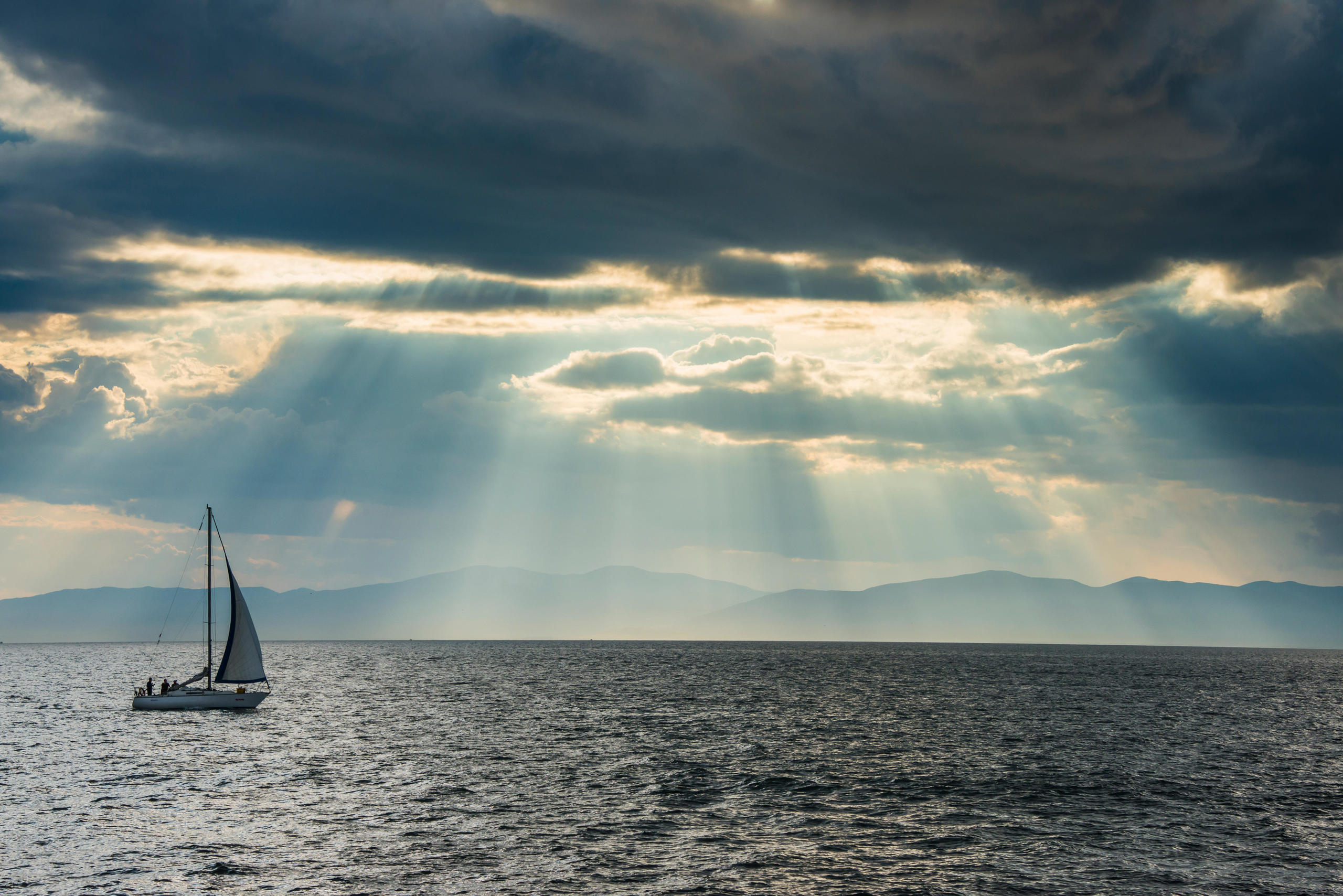 Boat on a lake under a cloudy sky