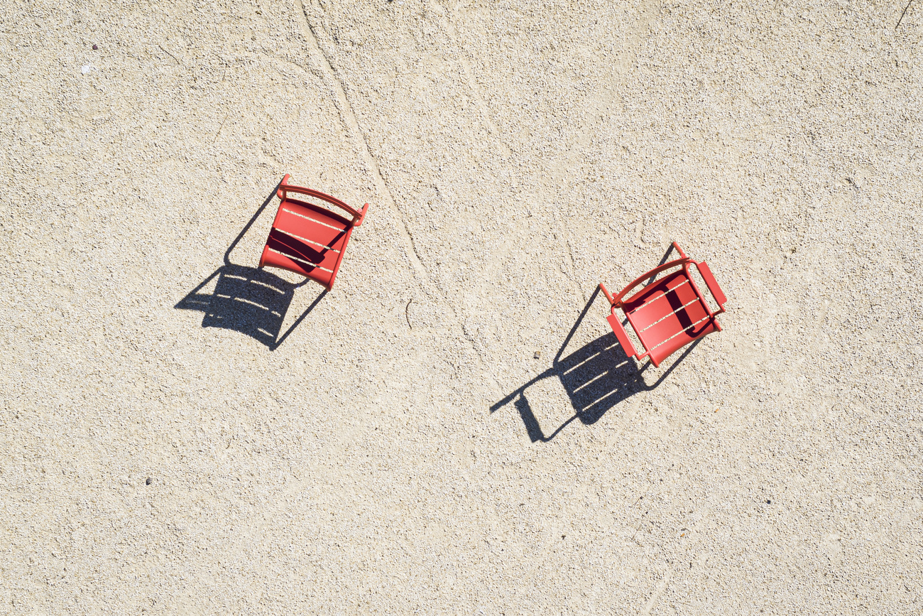 Empty chairs on a terrace