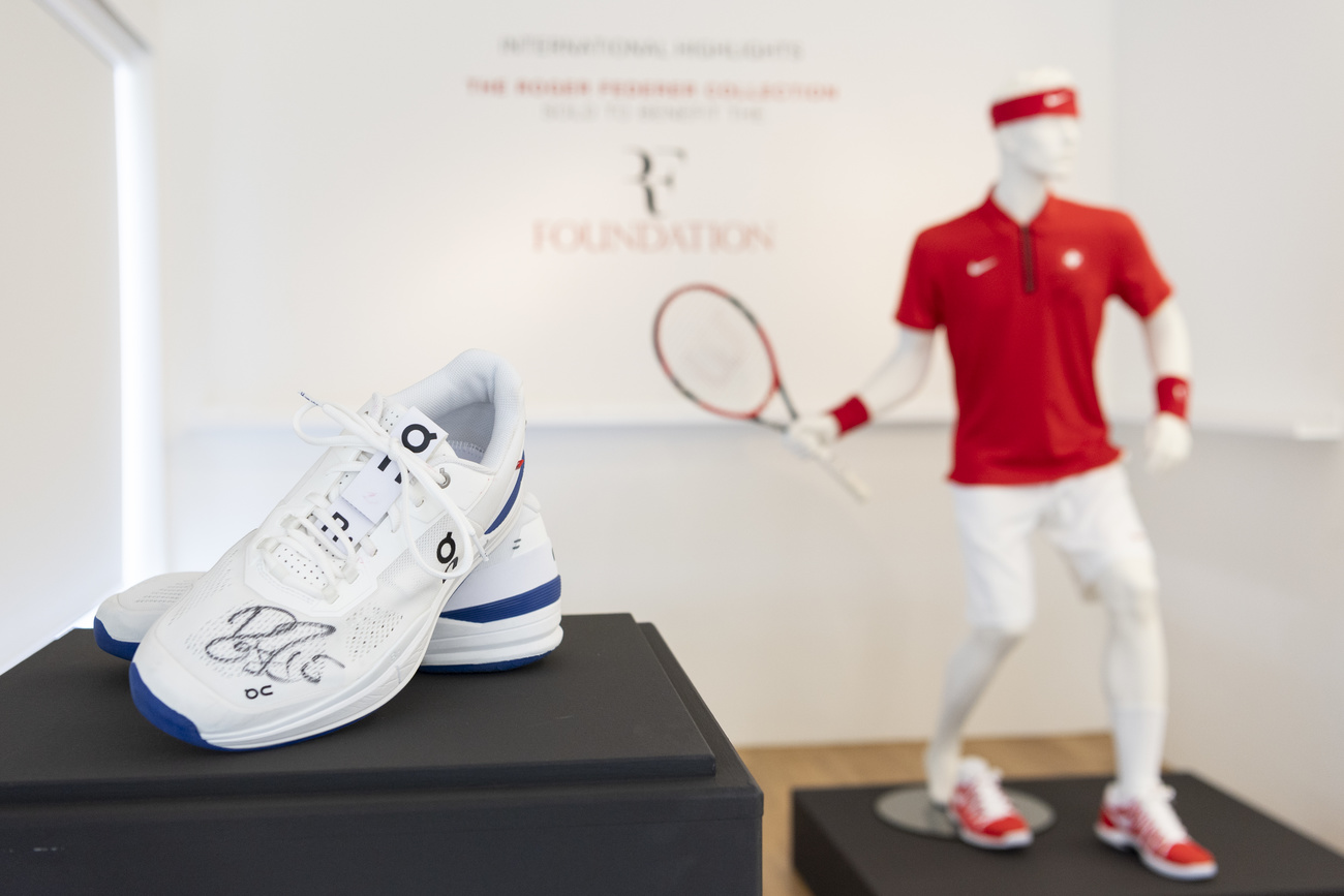 sneakers and a mannequin with tennis racket