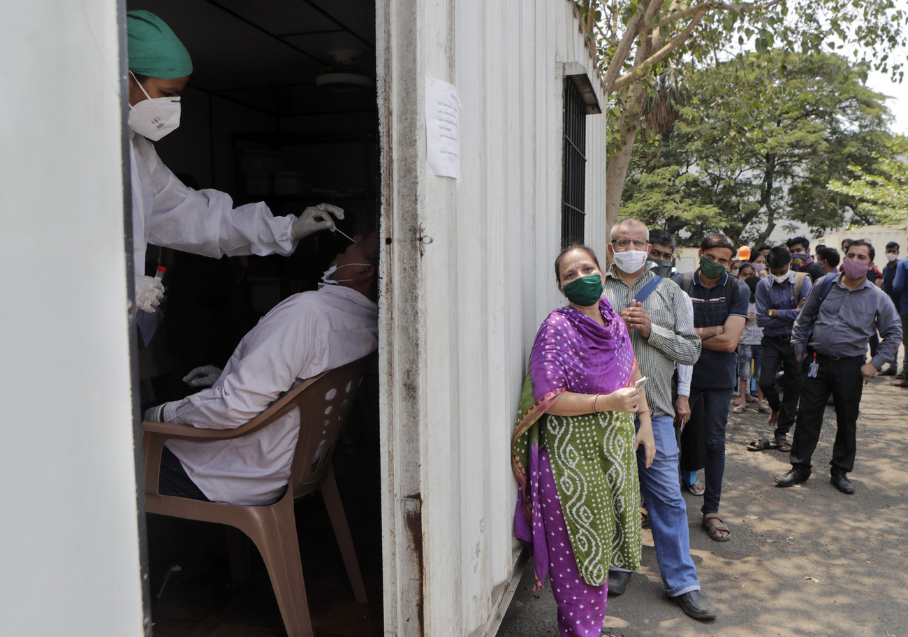 Citizens of India line up for a nasal swab.