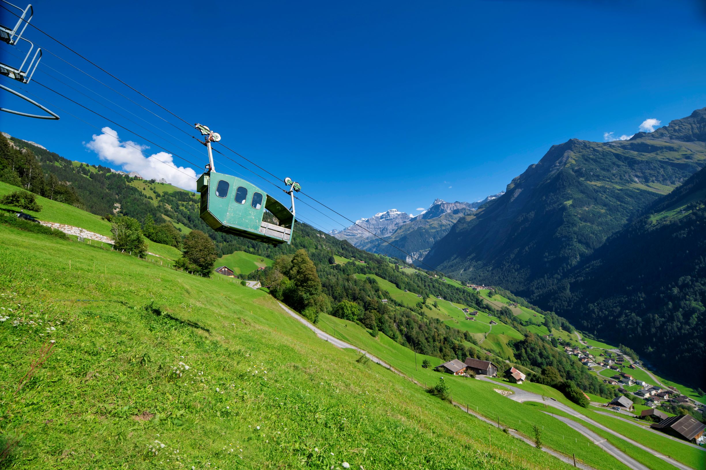 Cable car suspended above steep slope