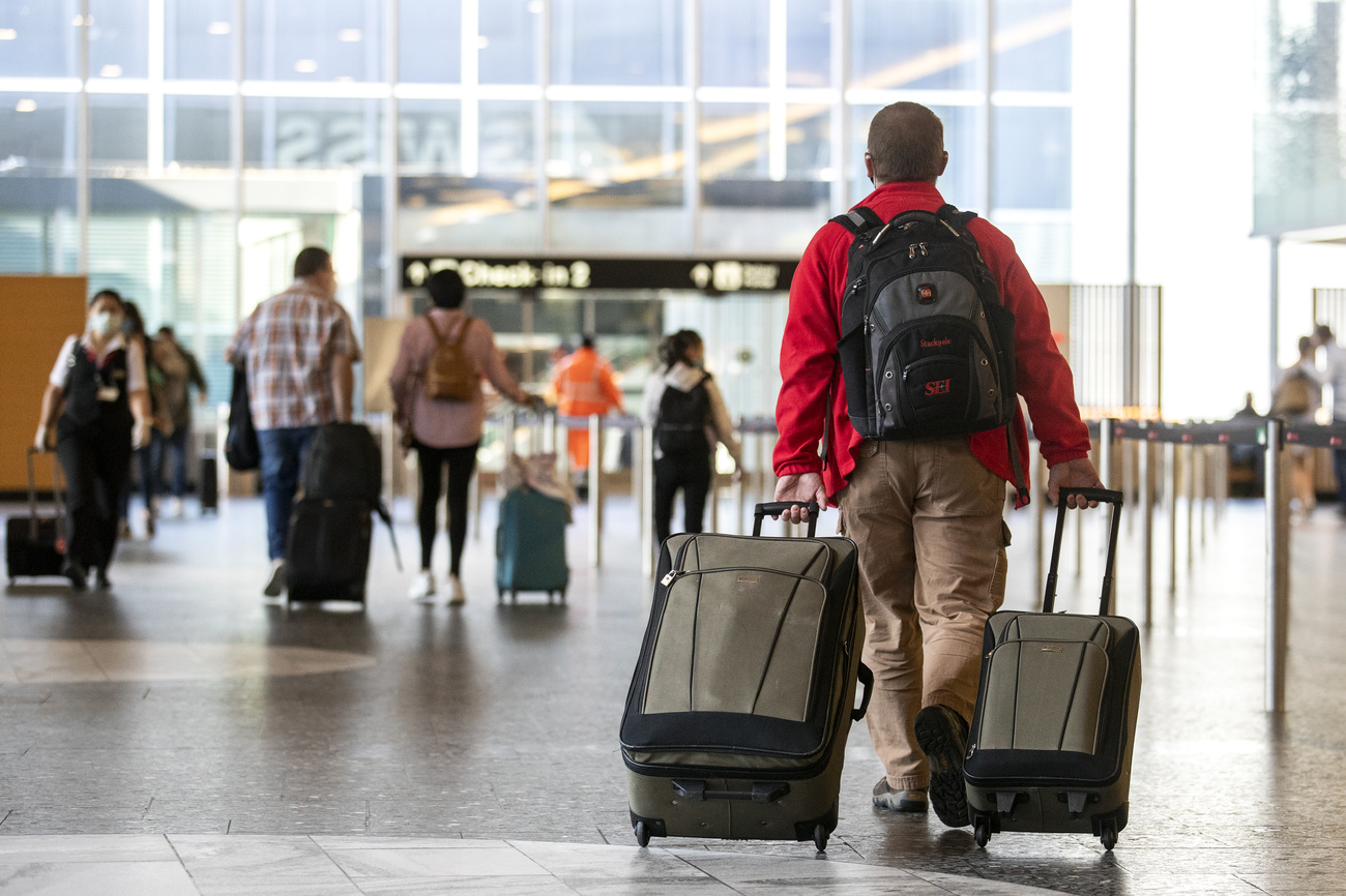 People with luggage at airport