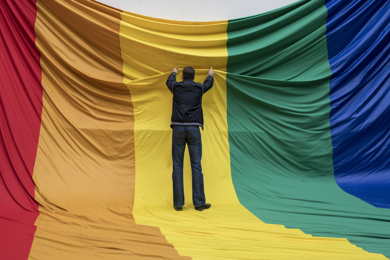 Man puts up LGBTQ flag