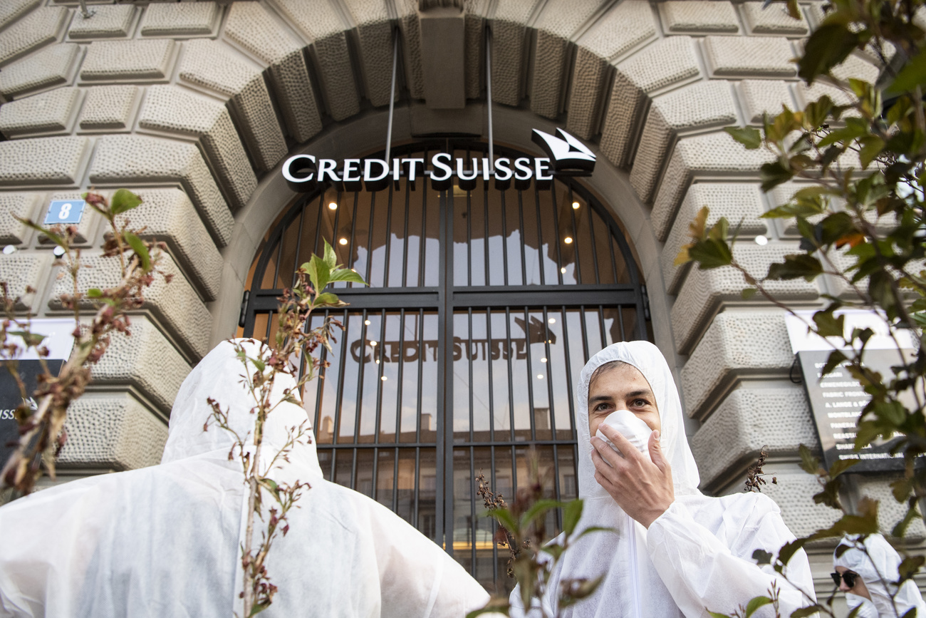 Environmental campaigners and Credit Suisse bank in Zurich.