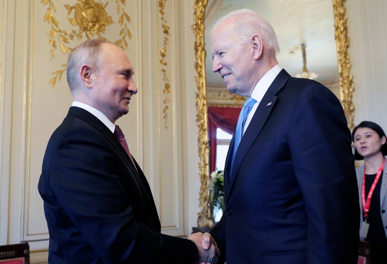 Biden and Putin shaking hands in Geneva