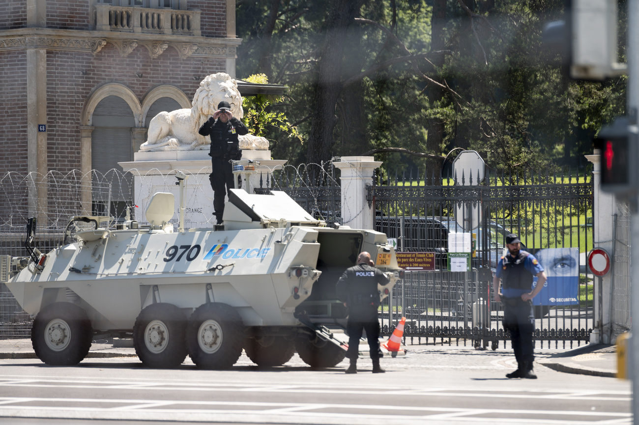 An armoured police vehicle takes position at the entrance of the Parc de La Grange.