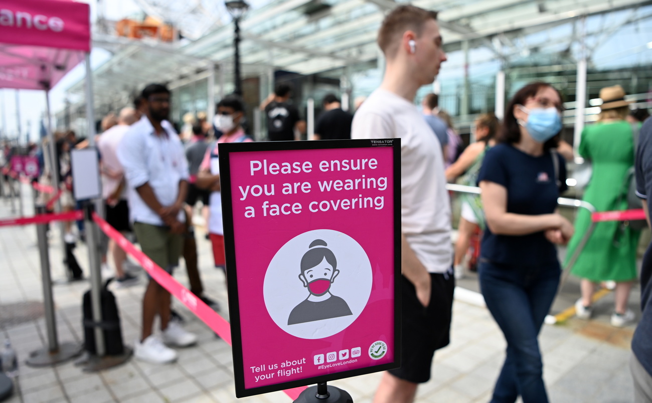 masked people queuing