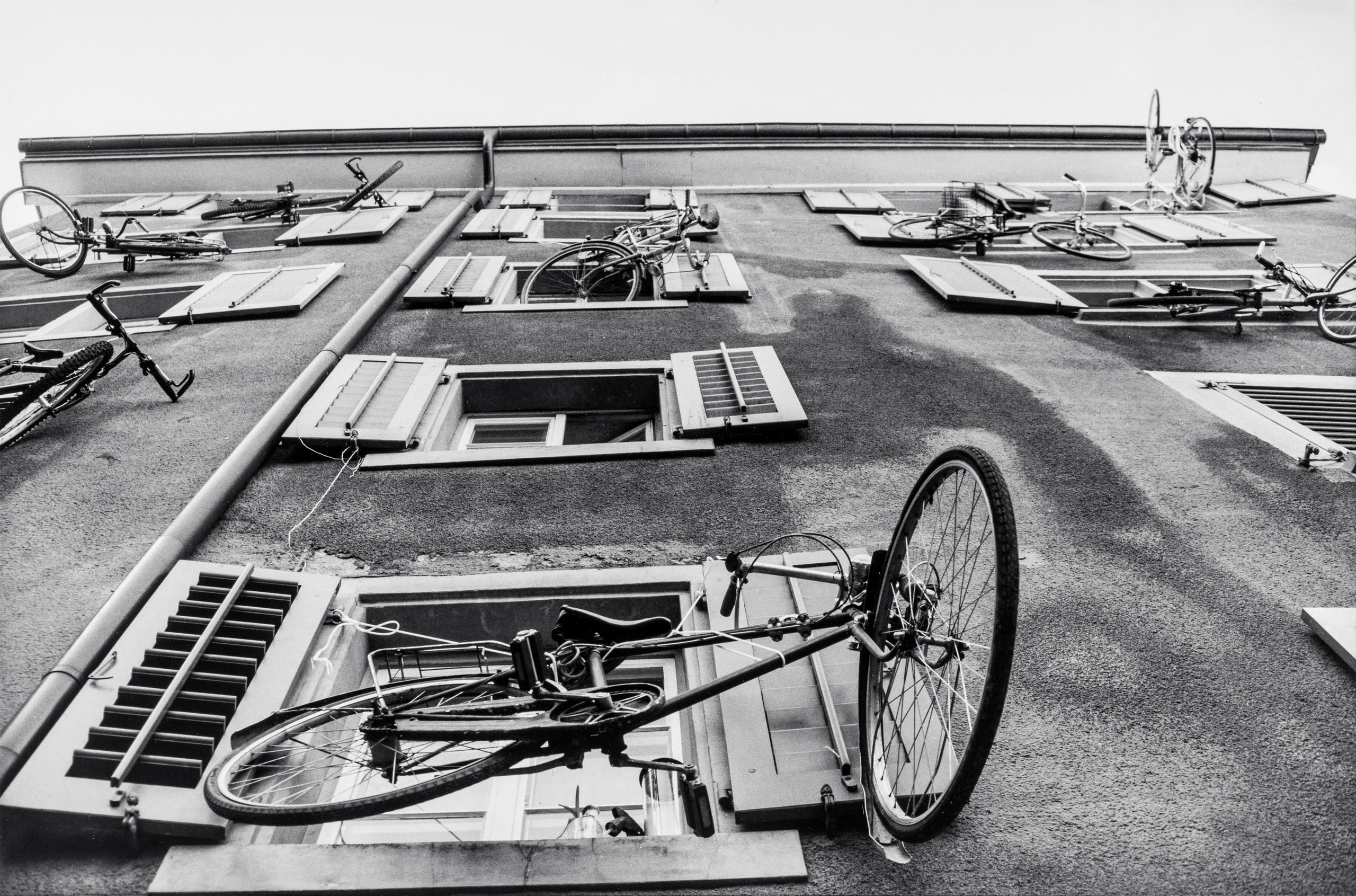 House facade Bikes hanging out of the windows