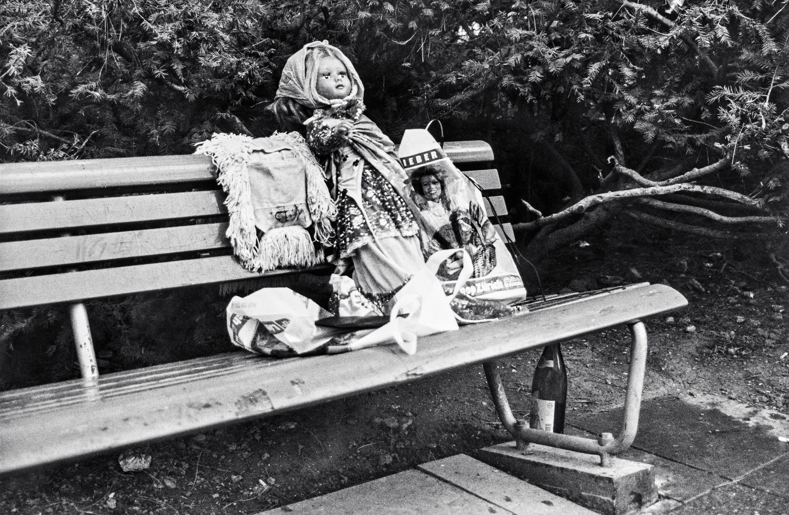 Doll on a park bench