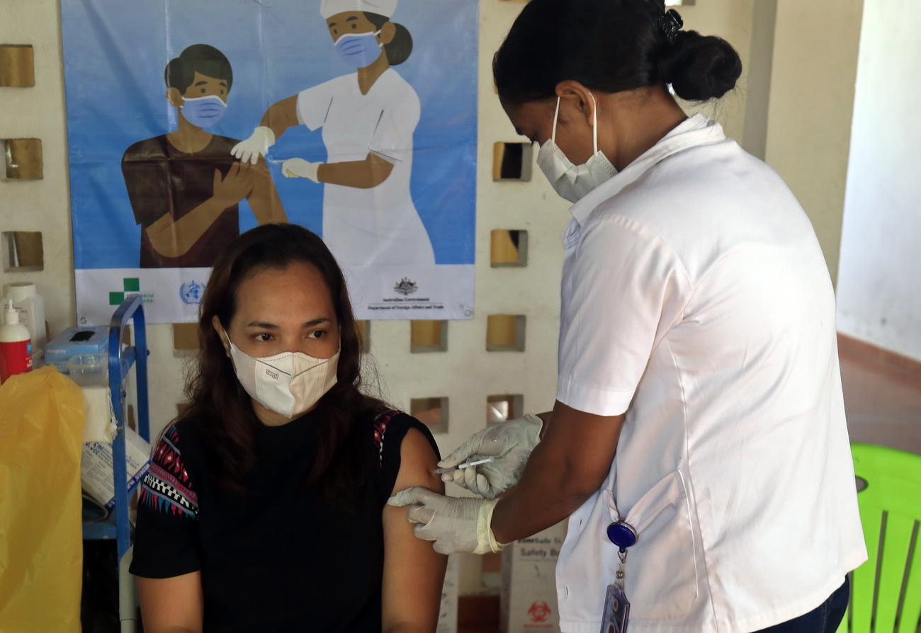 Woman in East Timor being vaccinated
