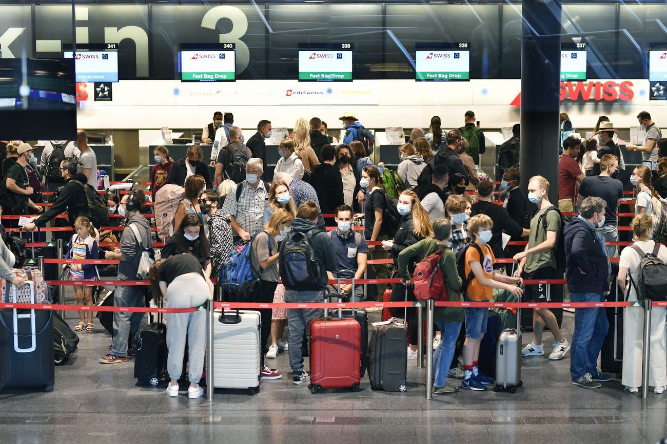 People queuing at airport.