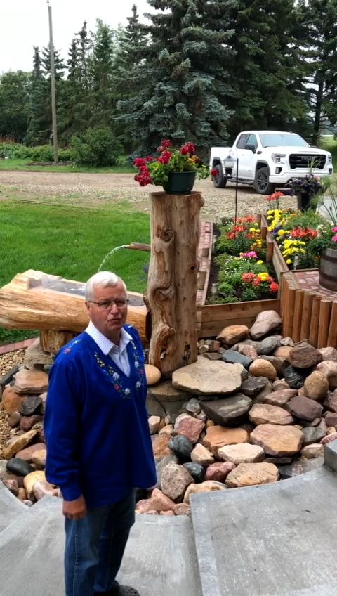 Fred Salvisberg standing next to a fountain