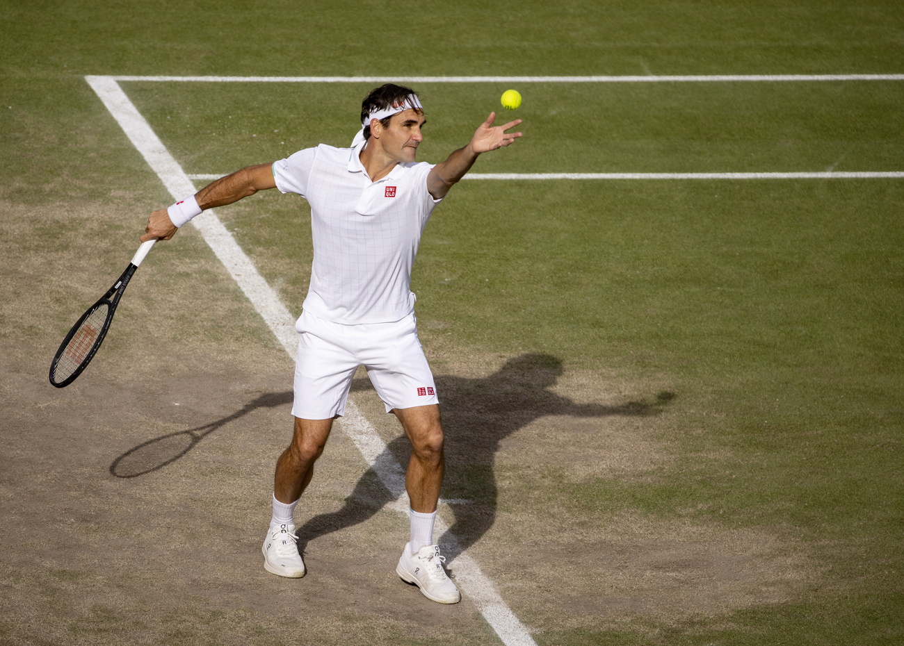Roger Federer serves at Wimbledon.