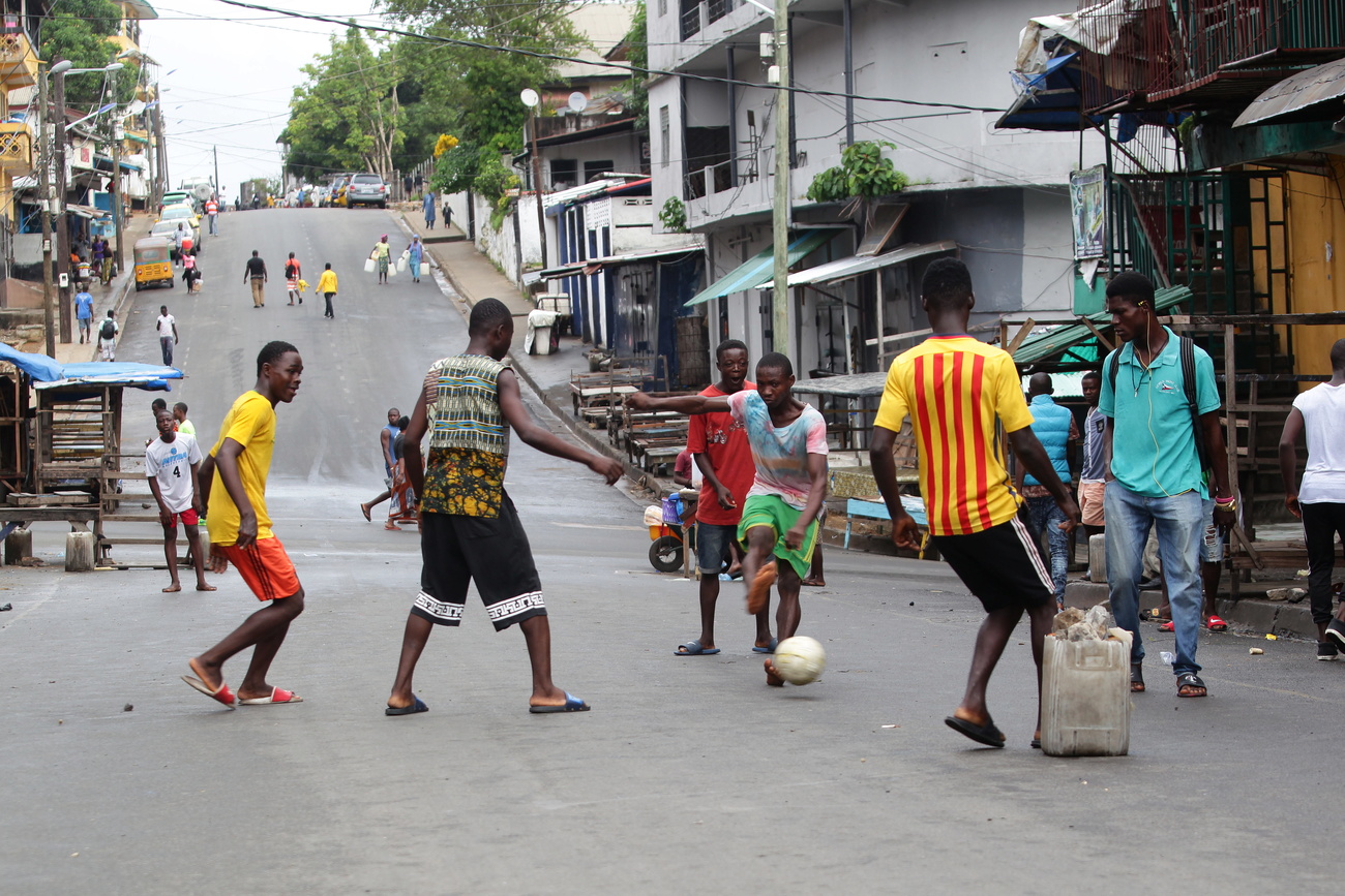 People playing football on the street