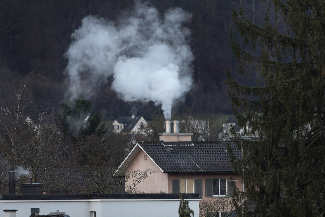 smoke coming out of chimney of a house in zurich