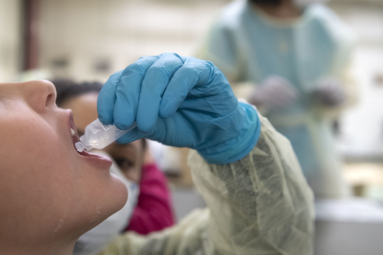 Person carrying out a PCR Covid test