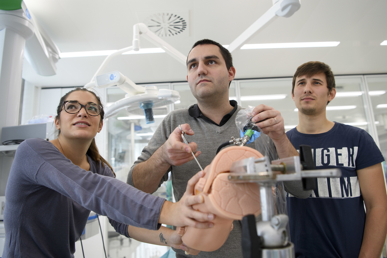 Surgical interns practice knee arthroscopy during a training session at the Swiss Foundation for Innovation and Training