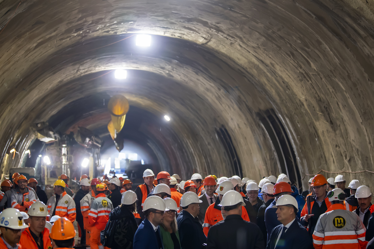 Workers meet in tunnel