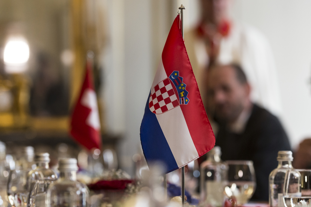 Croatia and Swiss flags.