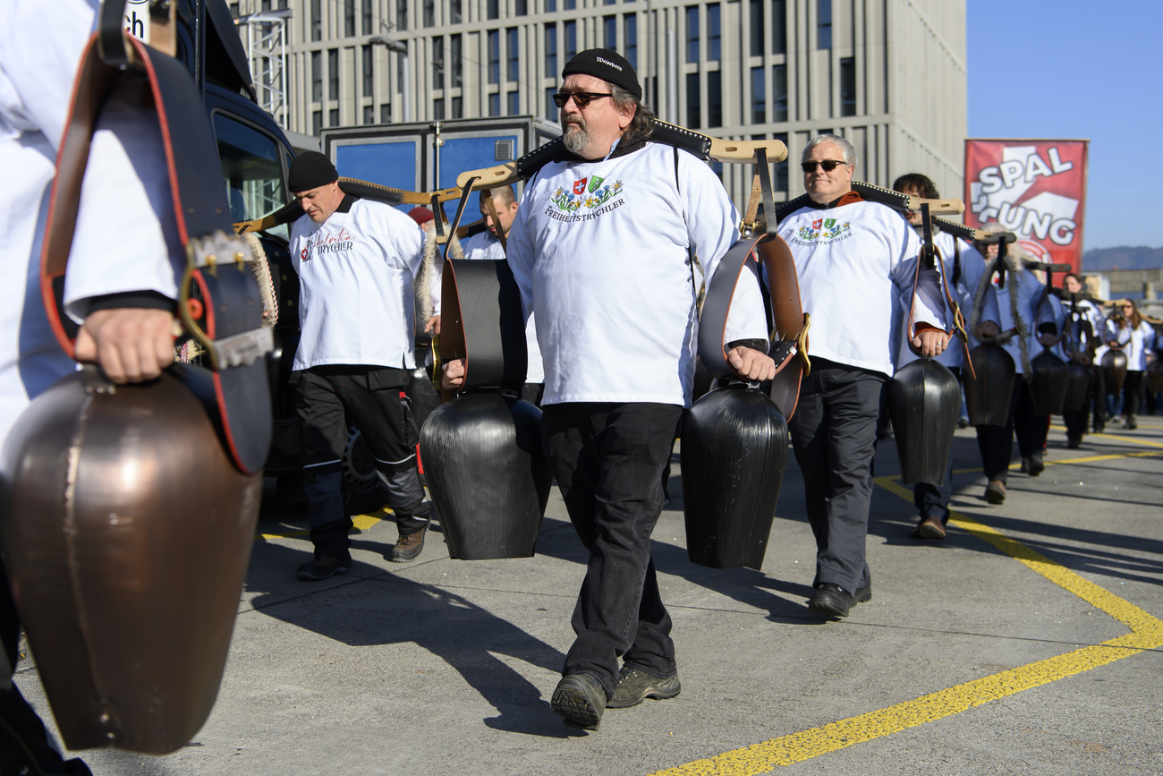Anti-vaxxers march with cowbells
