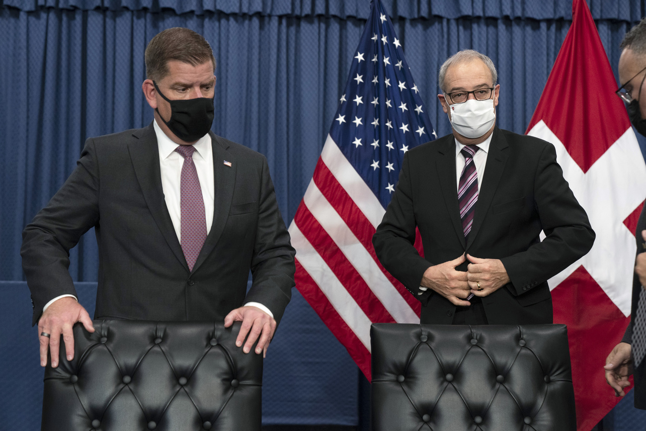 US labor secretary Walsh and Swiss president Parmelin posing in conference room