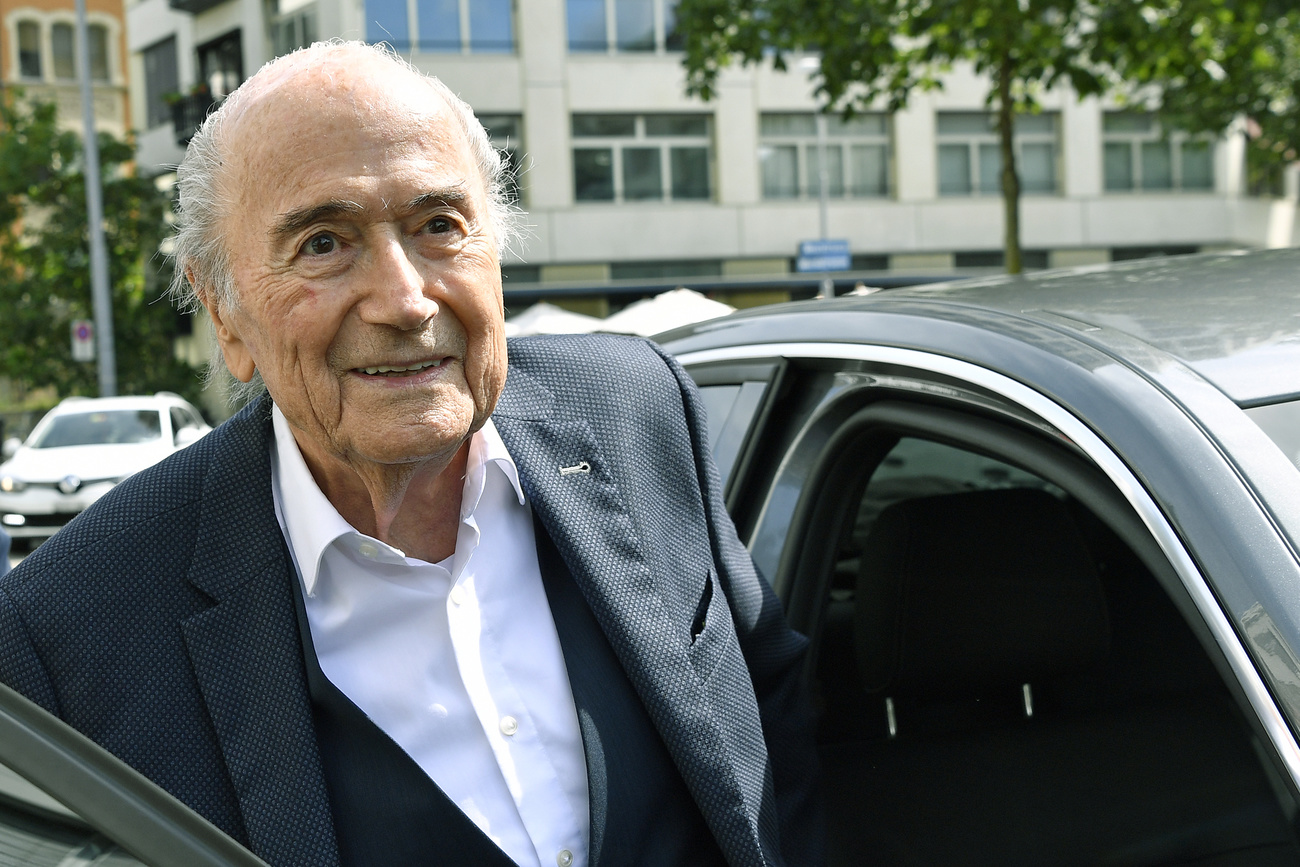 Blatter getting into a car