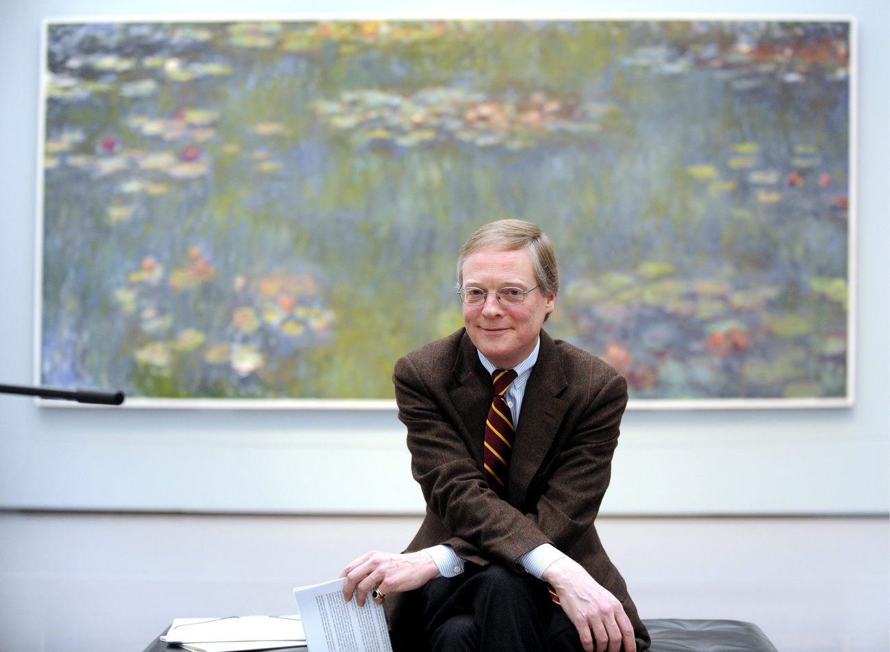 Lukas Gloor sits in front of Claude Monet s Le Basin aux nympheas.