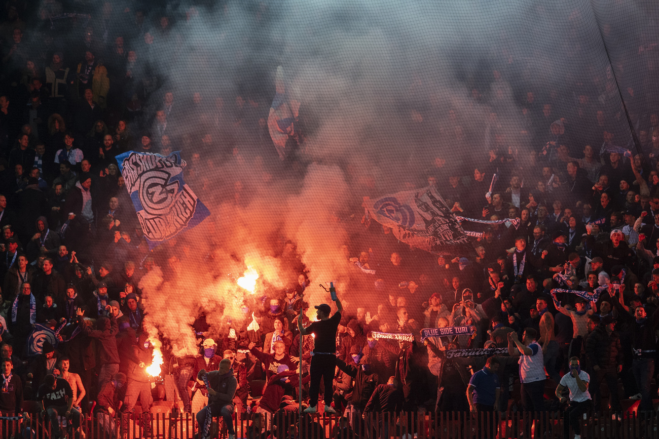 Swiss football fans with fireworks.