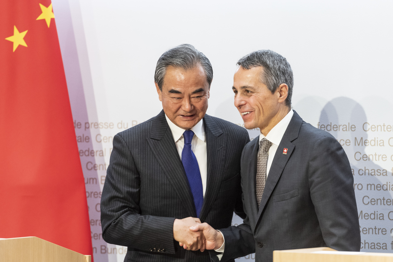 Ignazio Cassis and Wang Yi shaking hands at an earlier meeting in Bern in 2019.