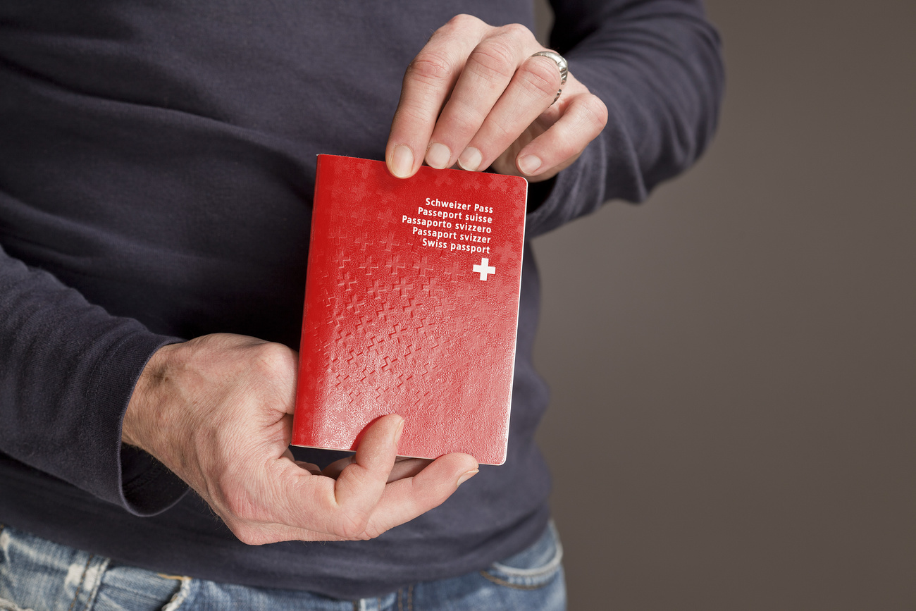 Swiss passport held by person