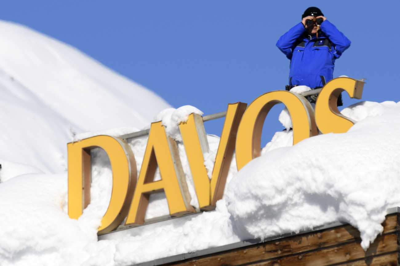 Policeman on the roof of a Davos hotel.