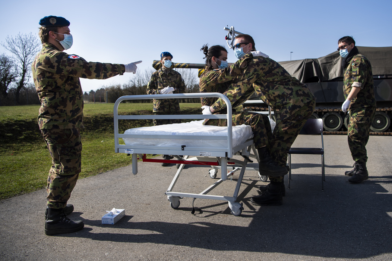 Swiss soldiers train to help during the covid-19 pandemic.