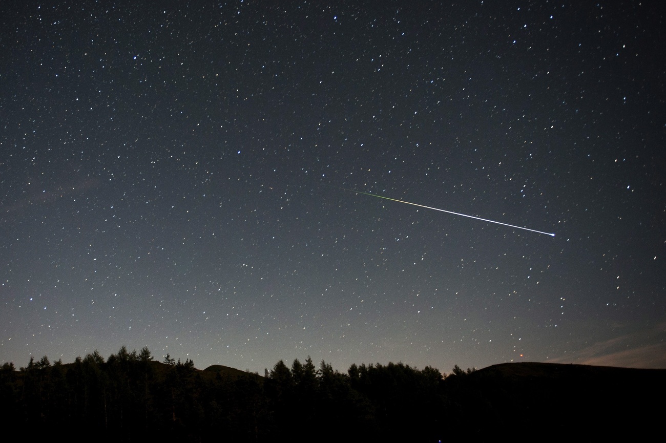 A meteor flies across the sky in Spain.