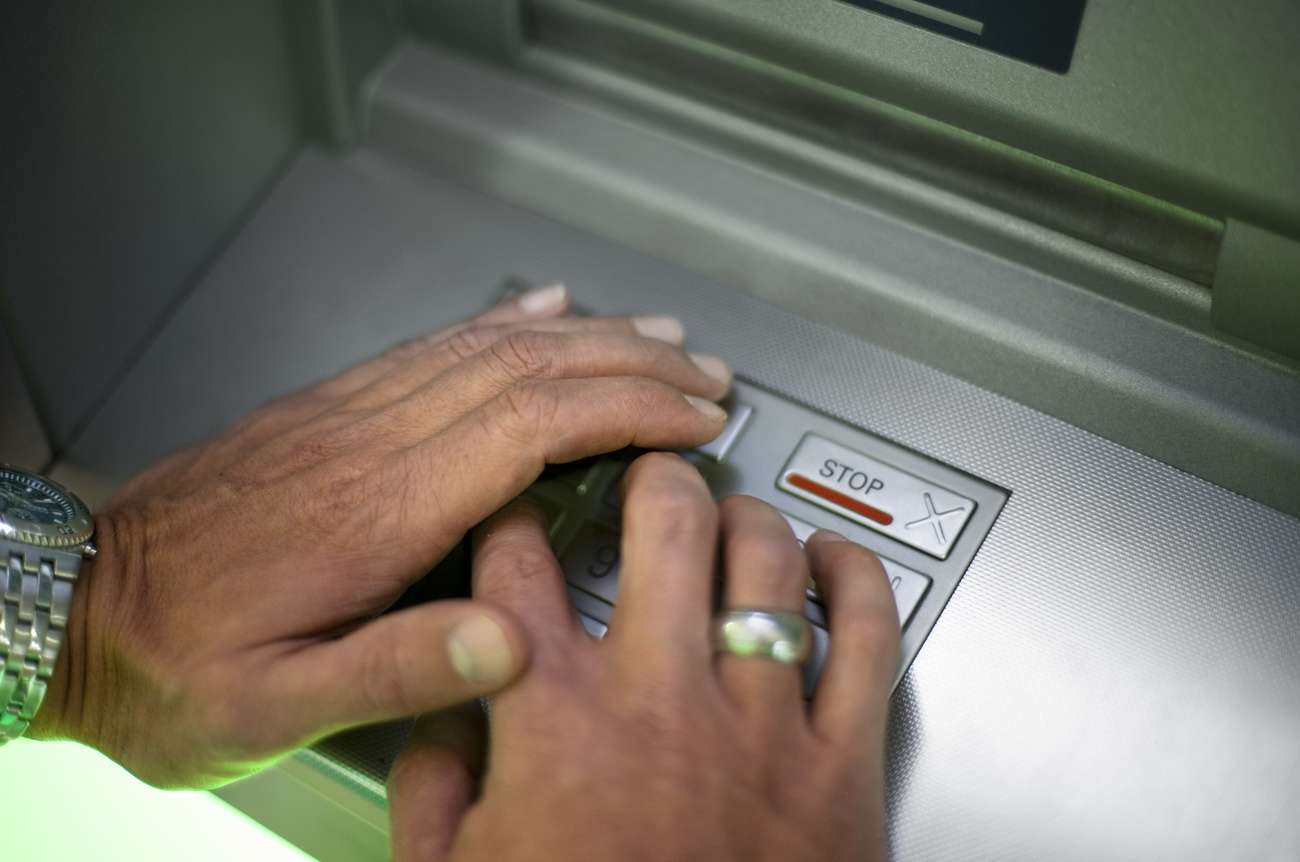 Person using ATM