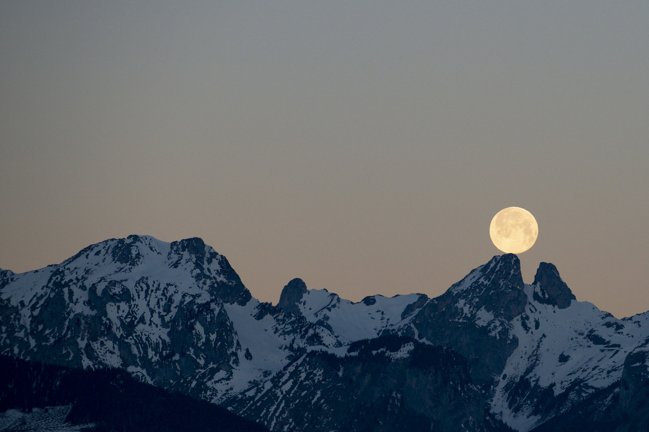 A full moon over the Les Jumelles in the Chablais Valaisan.