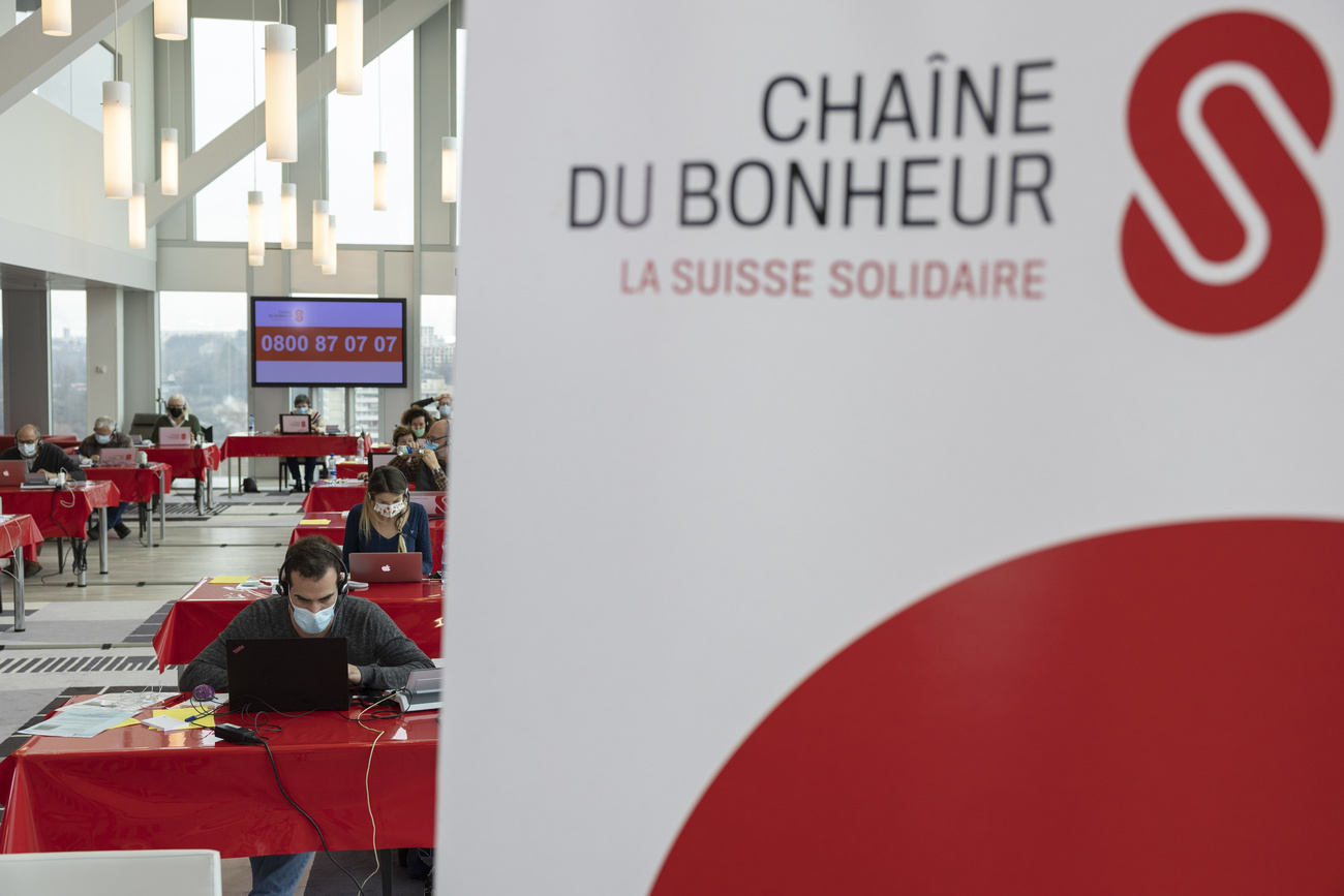 Swiss Solidarity volunteers collect money by phone.
