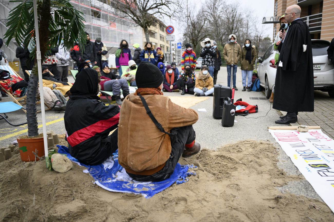 Supporters of the accused gather outside the Swiss court