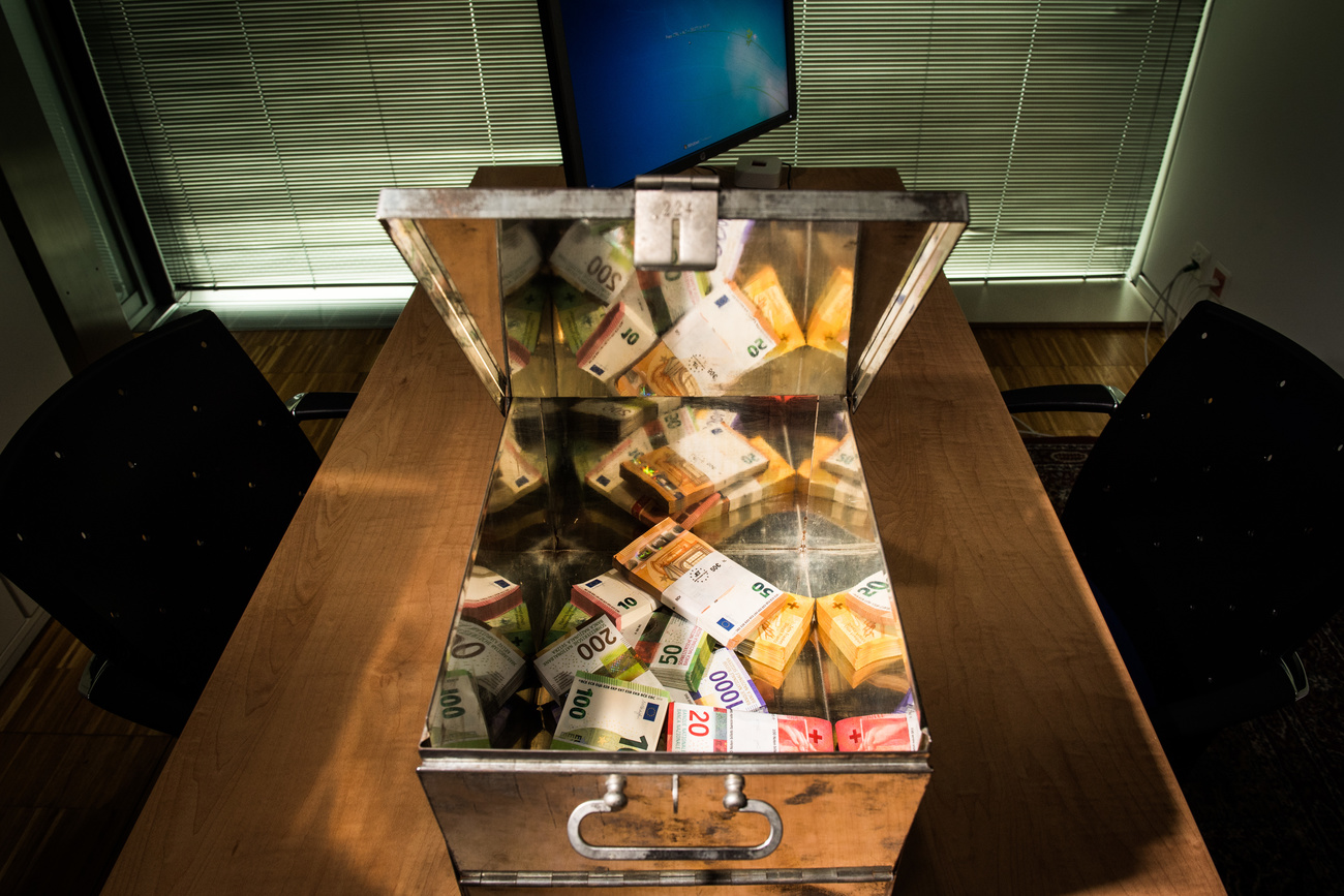 A bank vault box with Swiss franc and euro bills.
