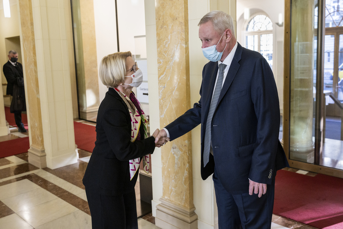 Swiss State Secretary Livia Leu shakes hands with Russian First Deputy Foreign Minister Vladimir Titov