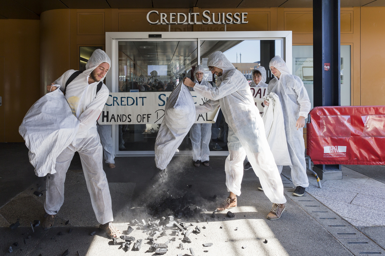 Environmental activists protest outside a Credit Suisse branch in Lausanne in 2018.