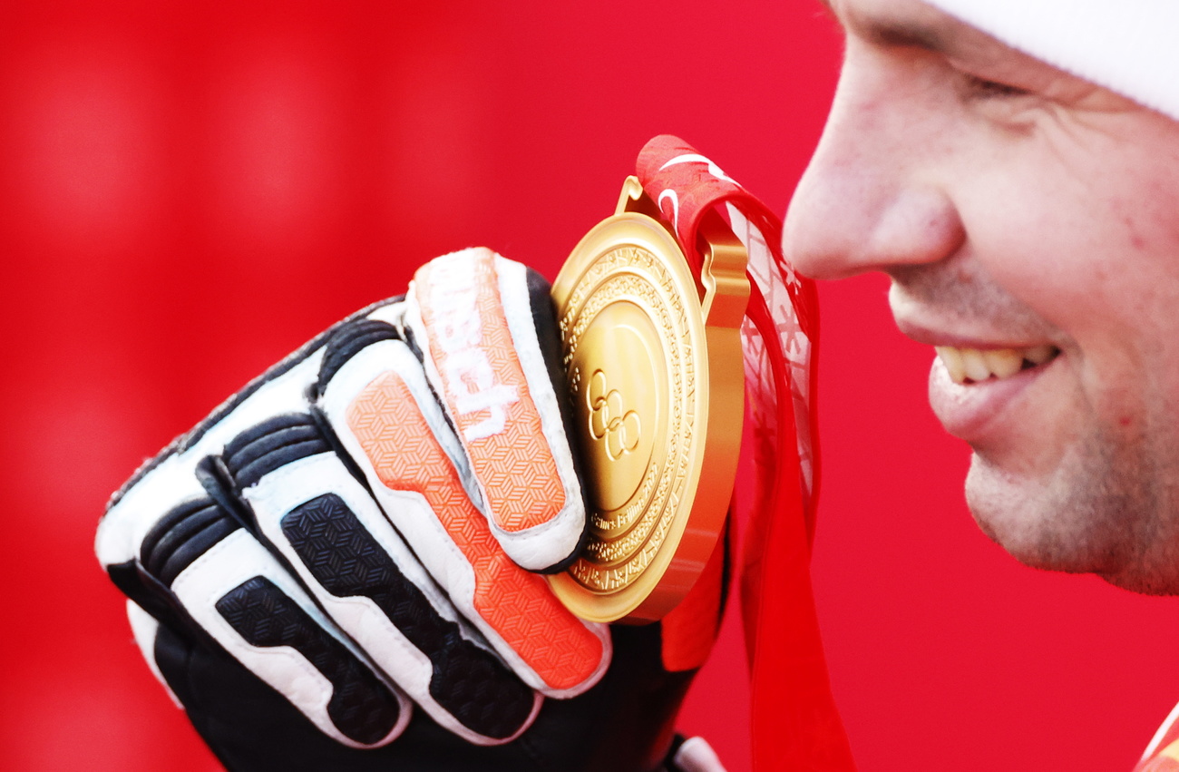 Beat Feuz gets gold medal for Beijing downhill.