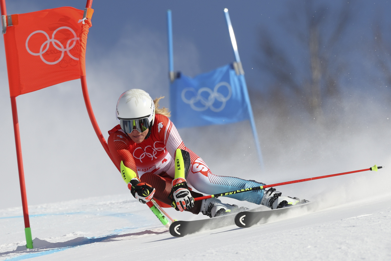 Lara Behrami-Gut races in the women s giant slalom at Beijing Winter Games.
